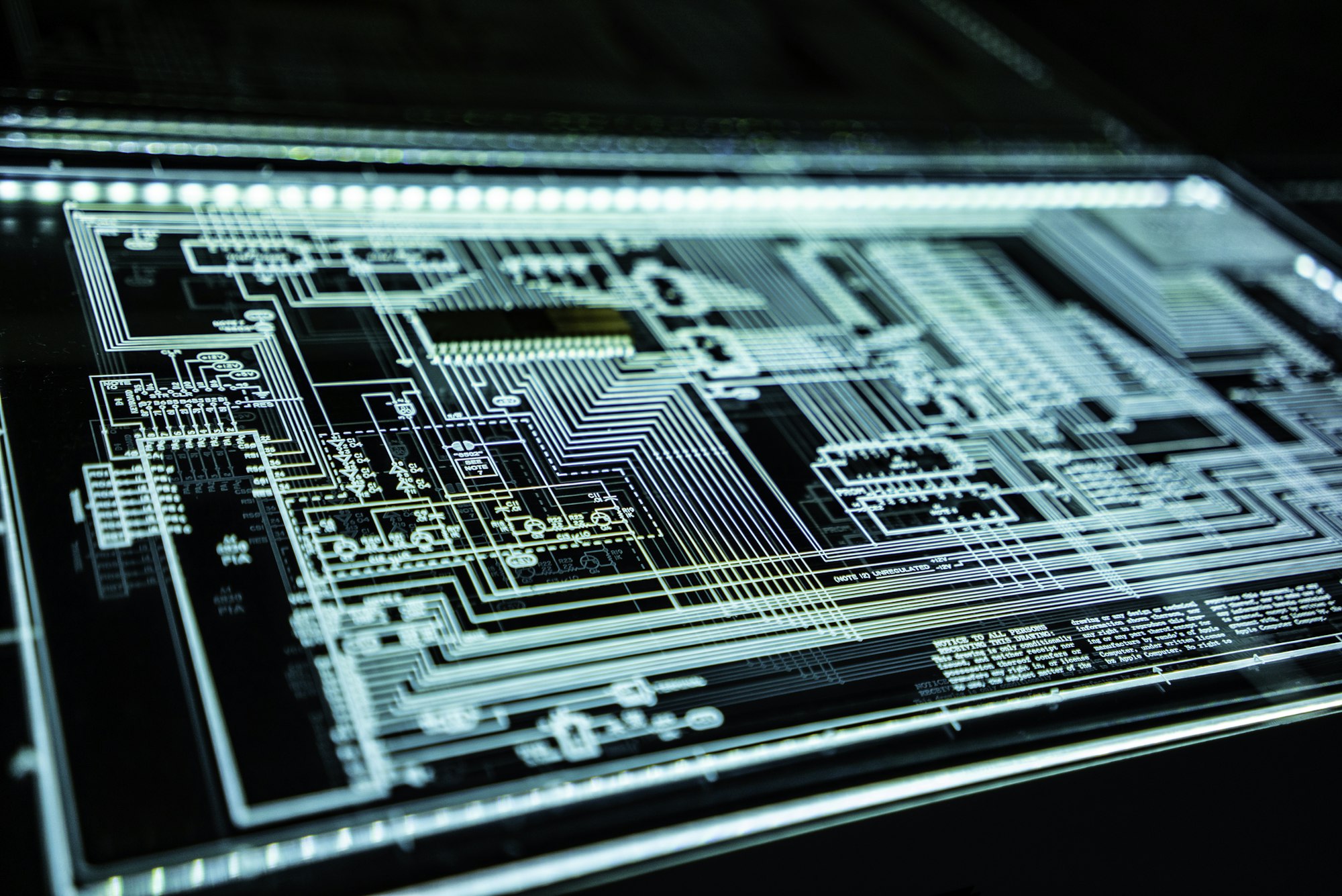 Circuit board lit in teal light