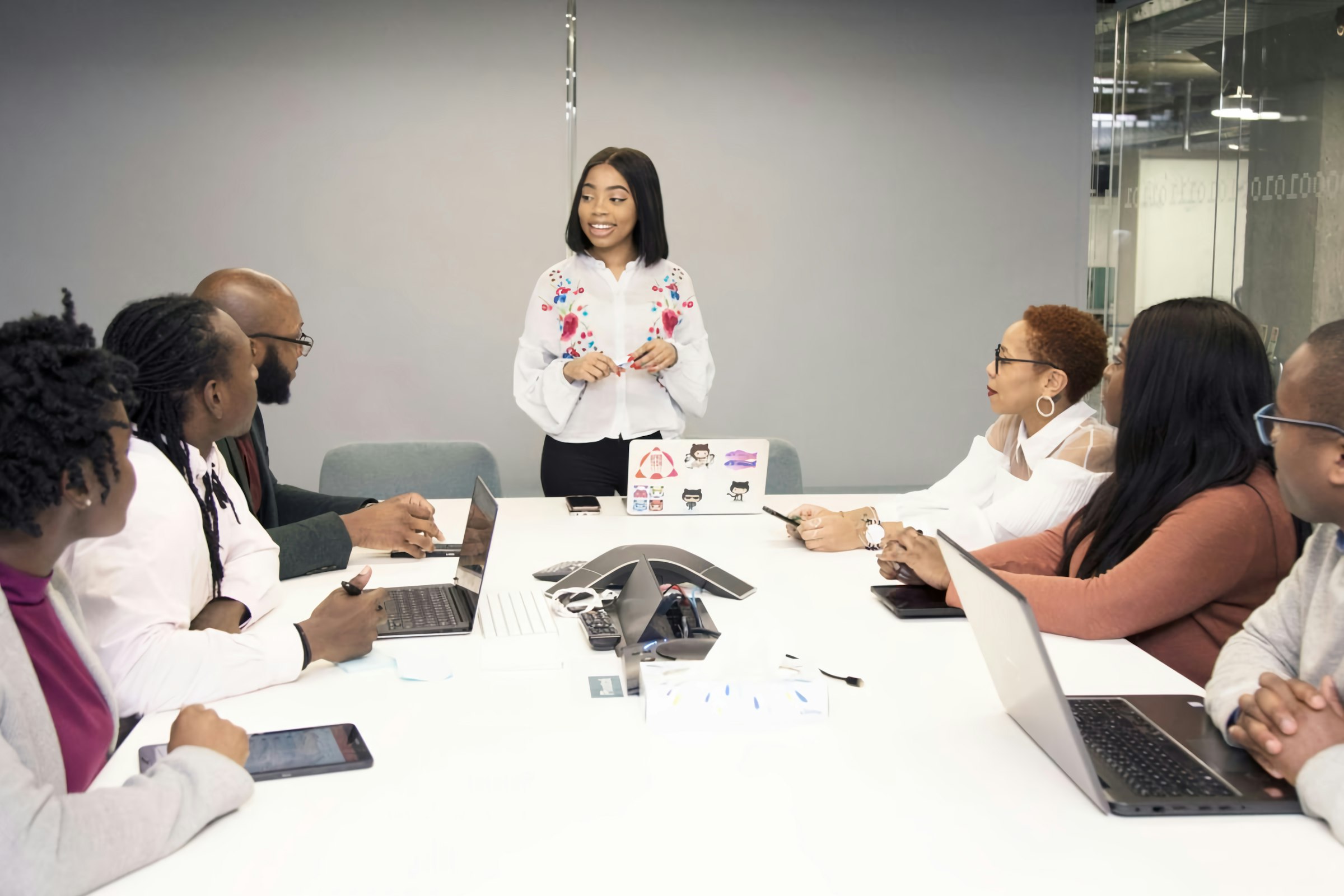 Presenter leading a training session for a diverse team